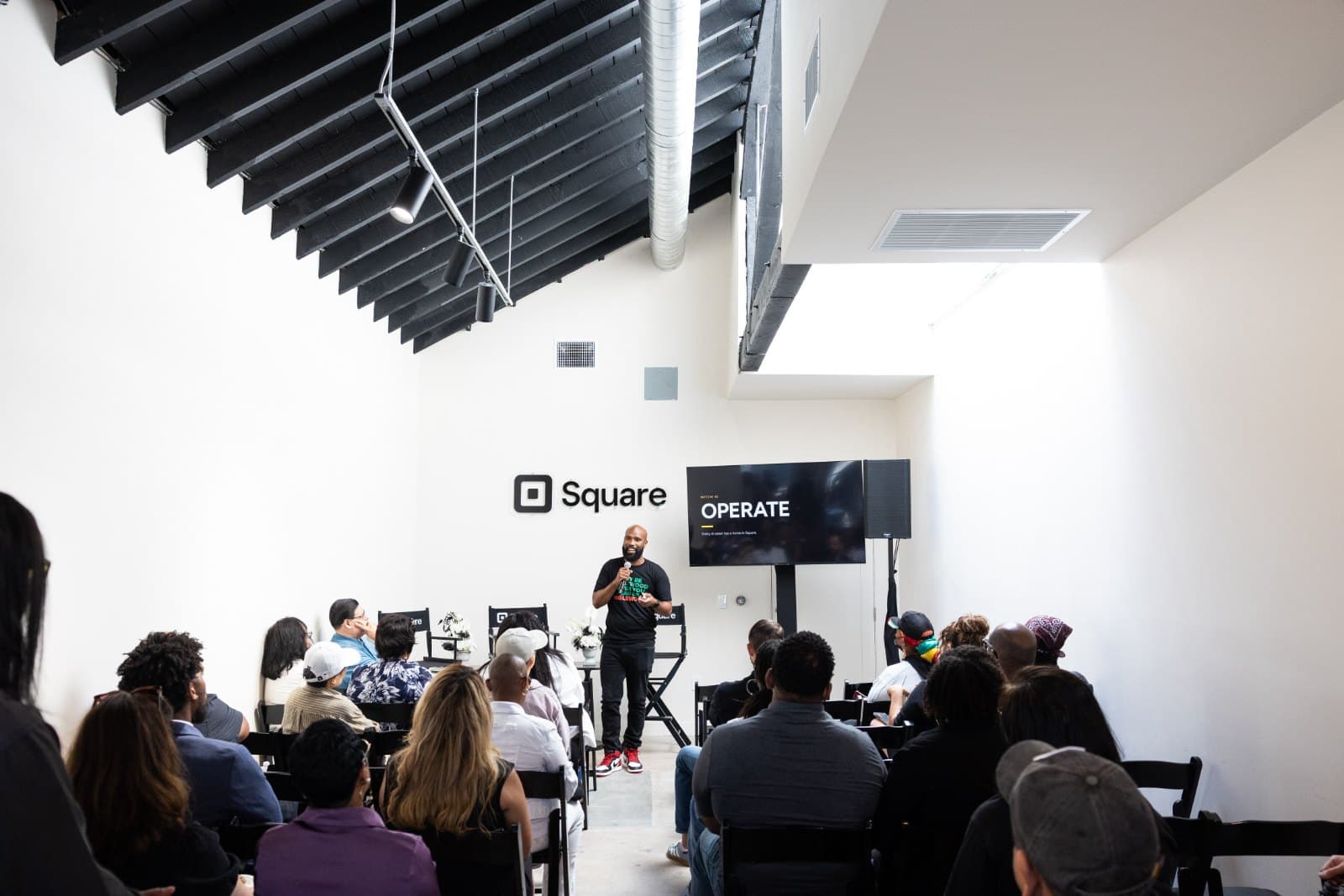 A Byrdie session: a room of owners with their laptops open and a speaker at the front.